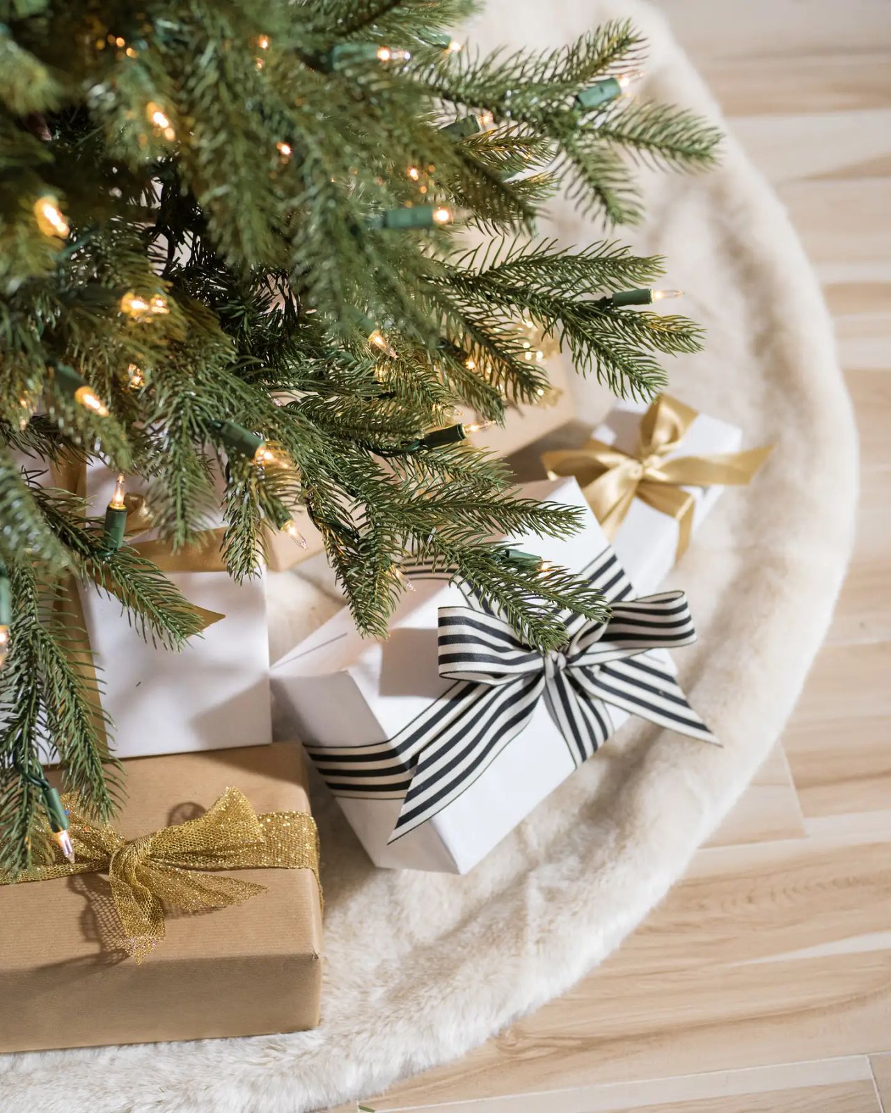 Gifts with Striking Ribbons Under a Slim Christmas Tree Gifts with Striking Ribbons Under a Slim Christmas Tree — Slim Christmas Tree Decor