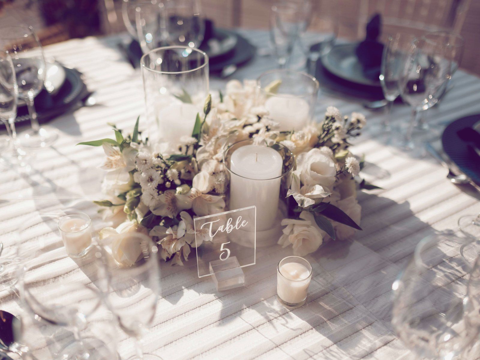 Elegant Outdoor Setting: White Florals and Clear Glass — Christmas Wedding Decor
