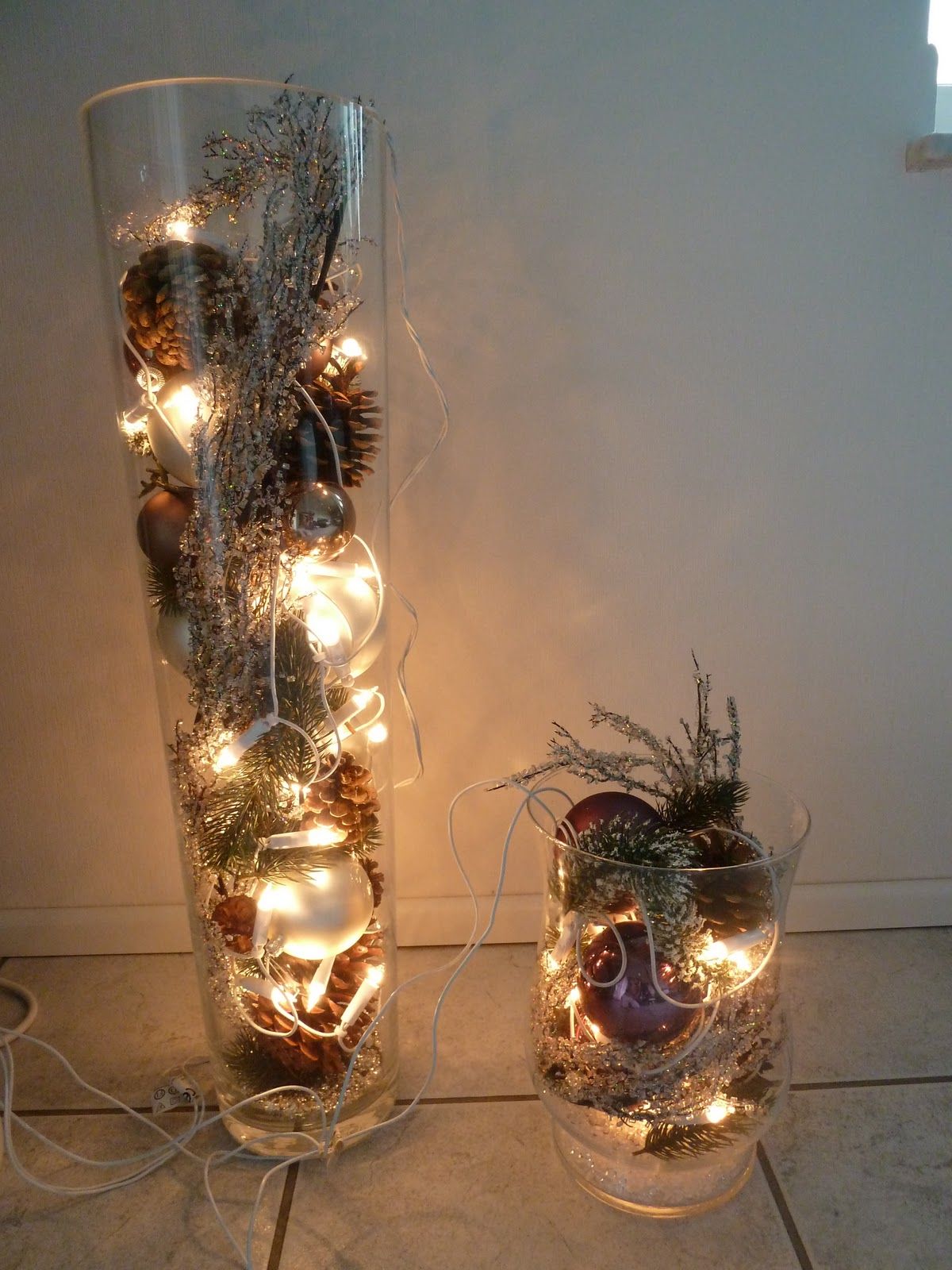Striking Vases Filled with Ornaments, Branches, and Fairy Lights Striking Vases Filled with Ornaments, Branches, and Fairy Lights — Christmas Light Display Ideas