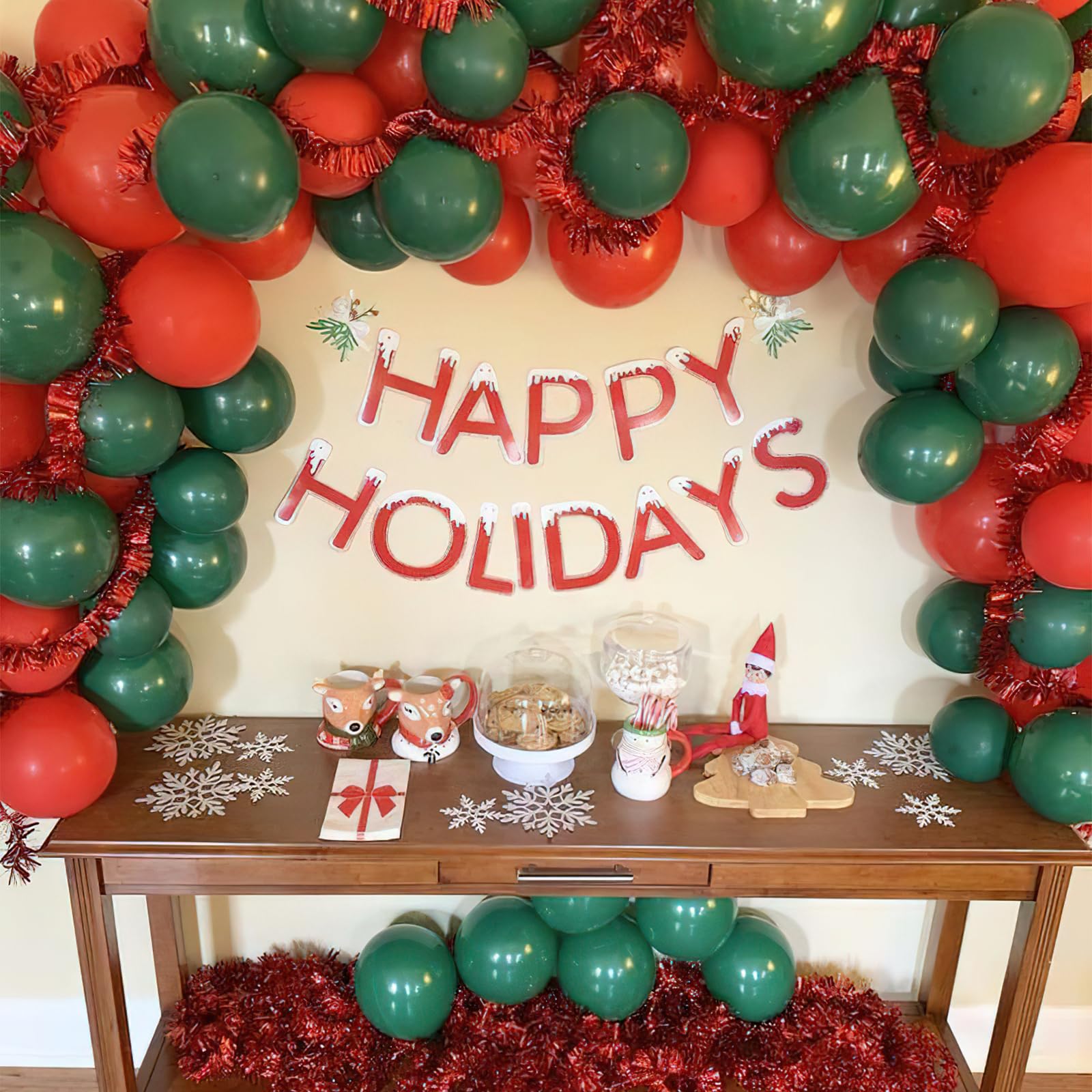 Vibrant Red and Green Balloon Garland Arching Over a Holiday Table Display — Christmas Balloon Garland