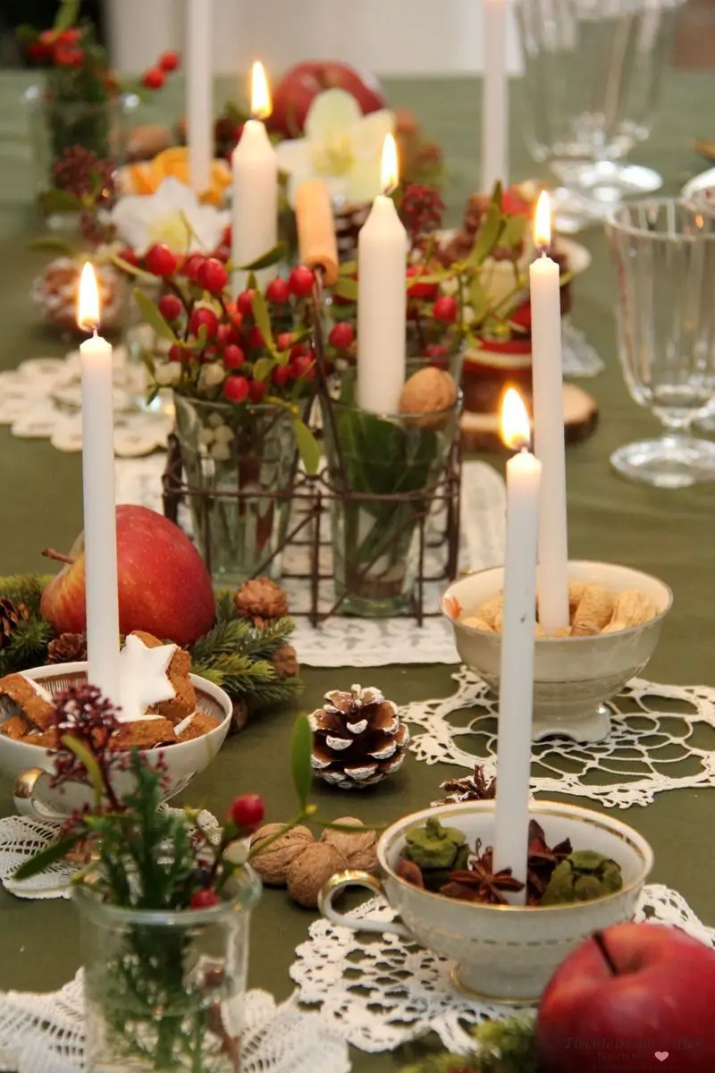 Traditional Table Abundant with Candles, Berries, and Apples — Christmas Table Setting