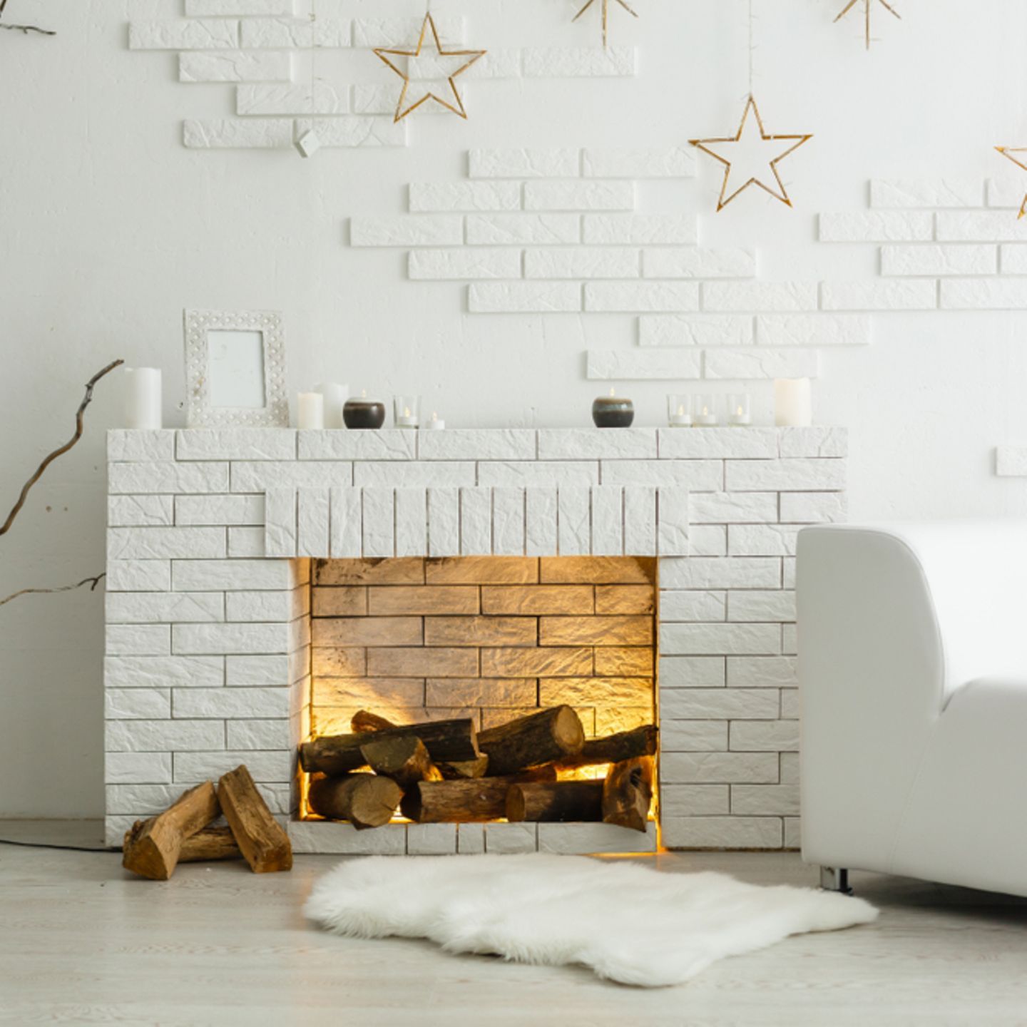 Modern White Brick Fireplace with Star Garlands and Logs — Winter Mantel Decor