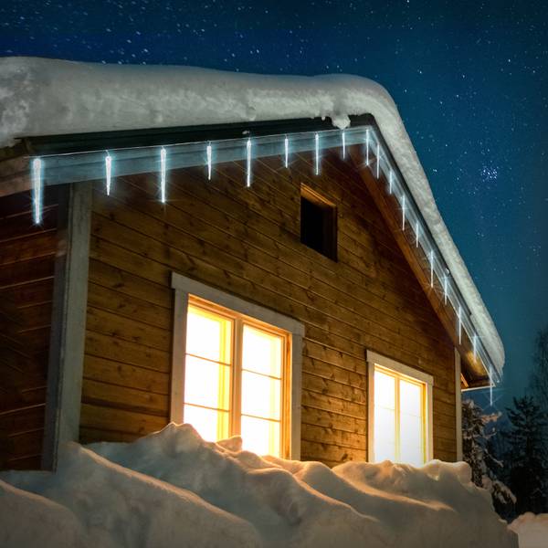 Contrasting Glow: Cold White Lights on Snowy Roofline Contrasting Glow: Cold White Lights on Snowy Roofline — Icicle Christmas Lights