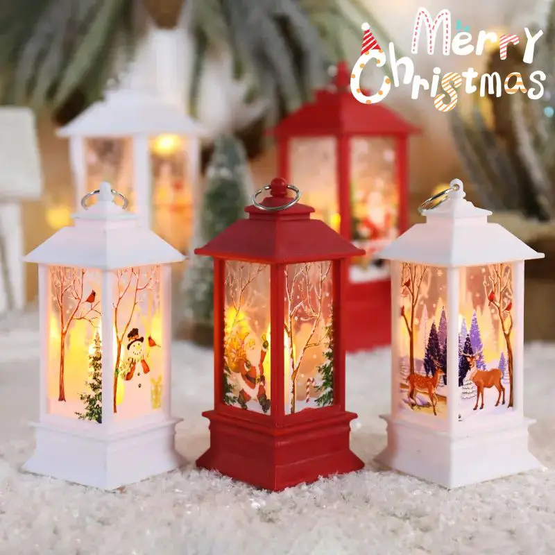 Collection of Small Christmas Scene Lanterns on Artificial Snow — Christmas Lantern Lights