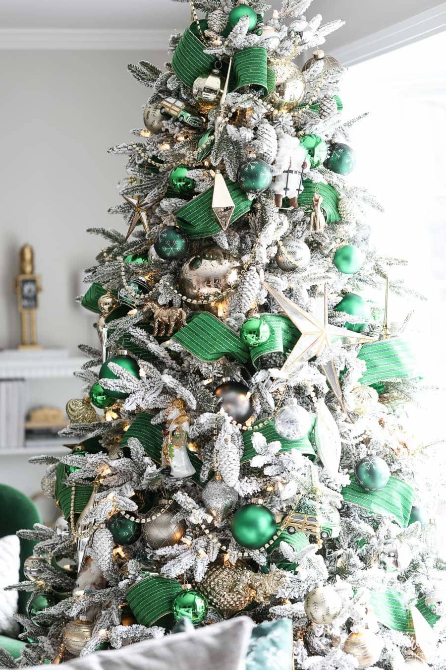 Heavily Decorated Flocked Tree with Vibrant Green Ribbon Heavily Decorated Flocked Tree with Vibrant Green Ribbon — Flocked Christmas Tree Decor