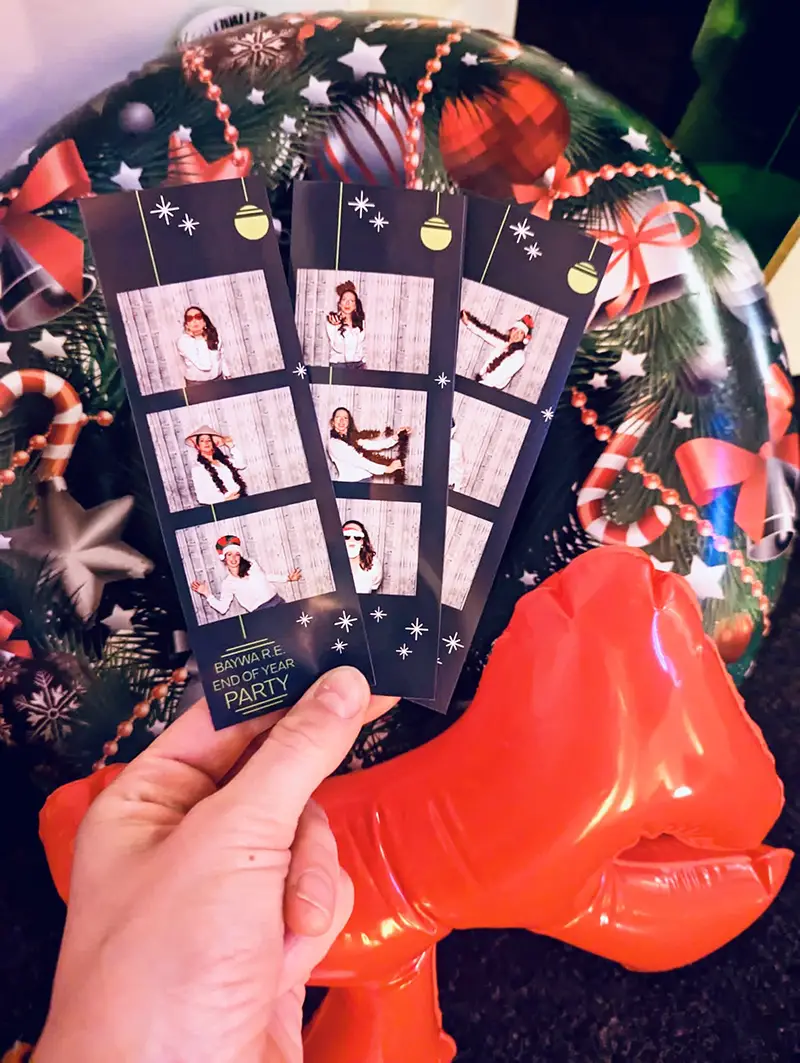 Photo Booth Strips and Inflatable Christmas Ring Backdrop — Christmas Party Backdrop