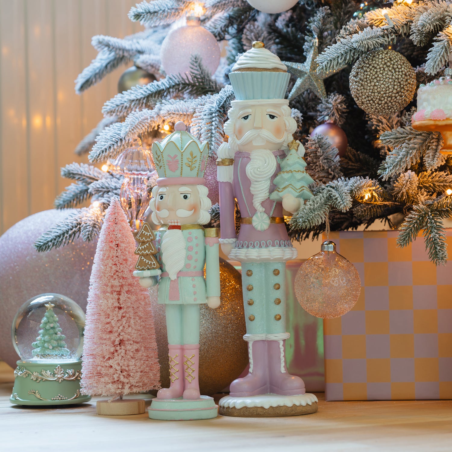 Whimsical Pastel Nutcrackers by a Flocked Christmas Tree — Nutcracker Christmas Decor