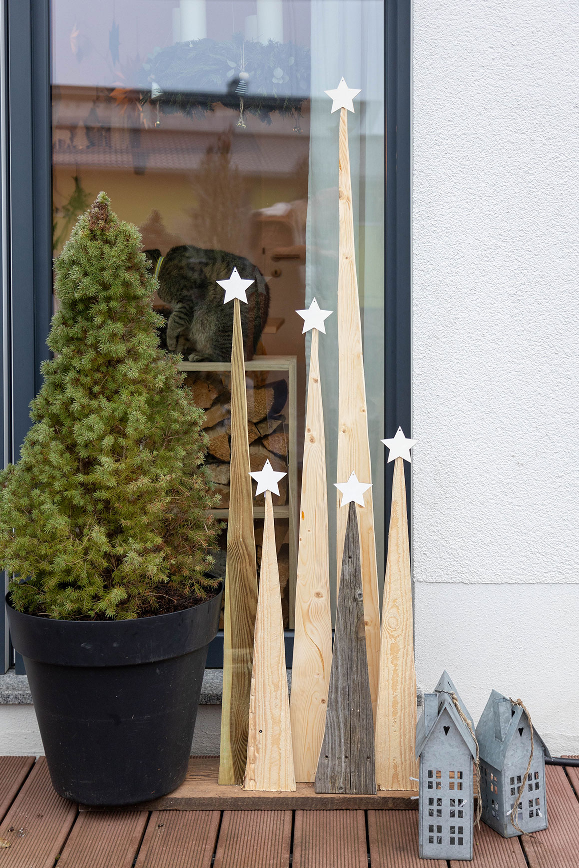 Collection of Natural Wooden Cone Trees on Deck Collection of Natural Wooden Cone Trees on Deck — Christmas Window Decor Outdoor