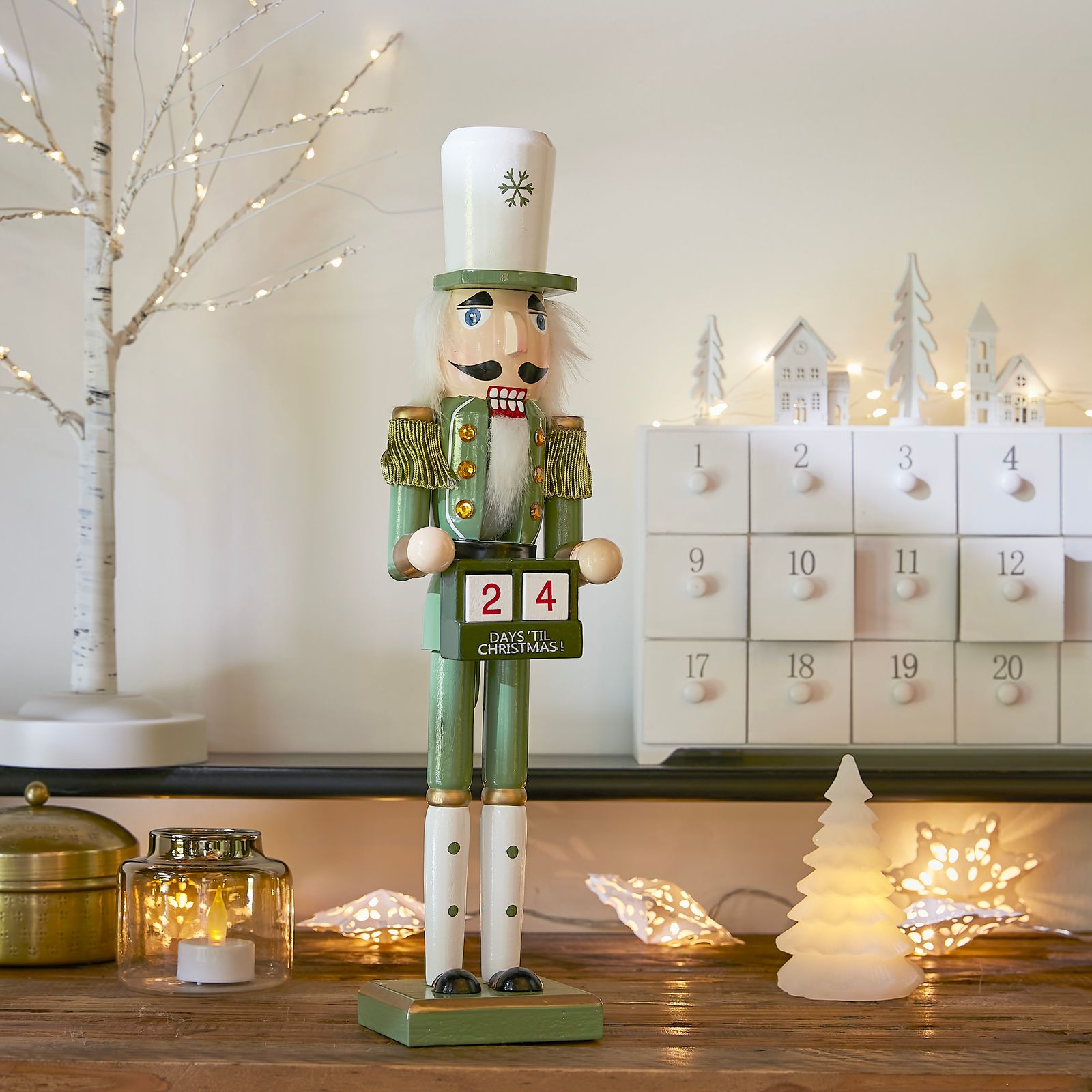 Nutcracker Holding Advent Calendar on a Festive Shelf — Nutcracker Display