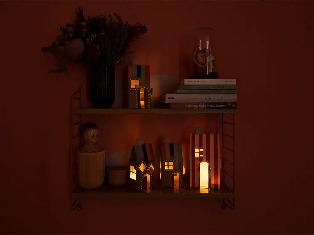 Modern Shelf with Glowing Paper Houses and Dried Flowers Modern Shelf with Glowing Paper Houses and Dried Flowers — Christmas Shelf Decor