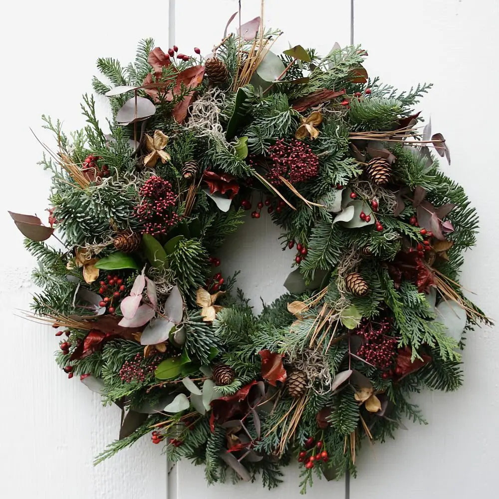 Rustic Evergreen Wreath with Natural Textures on White Door Rustic Evergreen Wreath with Natural Textures on White Door — Ornament Wreath