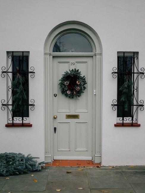 Classic Pale Gray Door with Lush Green Wreath — Winter Front Door Decor
