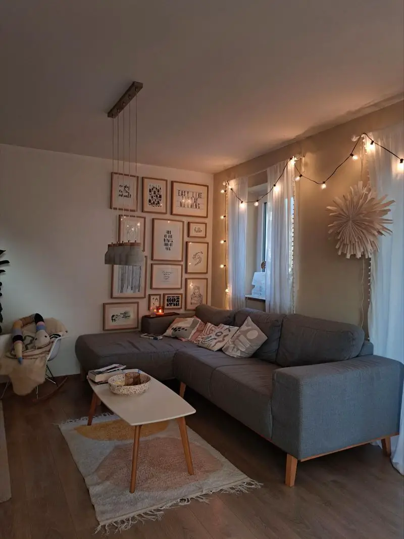 Modern Living Room with Fairy Lights Draped Over Sofa and Wall Modern Living Room with Fairy Lights Draped Over Sofa and Wall — Christmas Fairy Lights Living Room