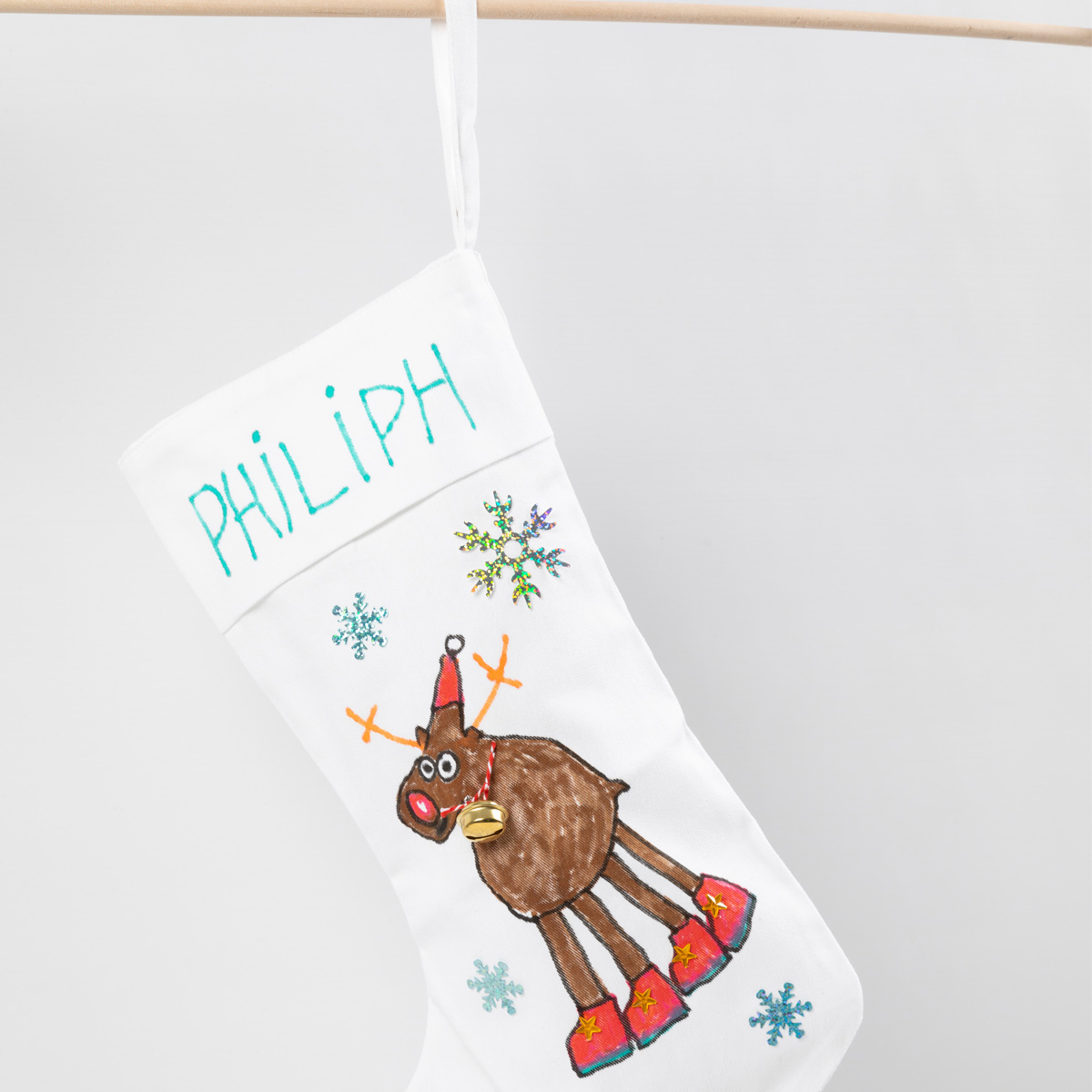 Personalized White Stocking with Hand-Drawn Reindeer — Christmas Stockings Display