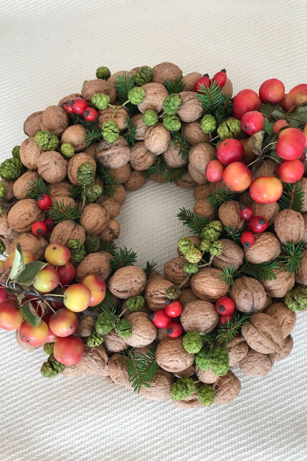Textured Nut Wreath with Red Apples and Berries Textured Nut Wreath with Red Apples and Berries — DIY Christmas Wreath