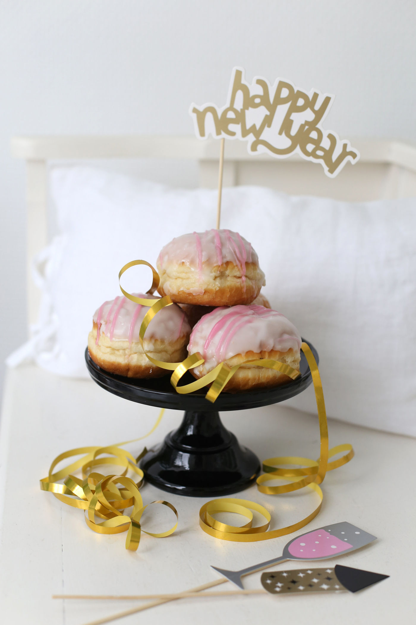 Pink Iced Donuts with Gold 'Happy New Year' Topper — New Years Eve Dessert Table