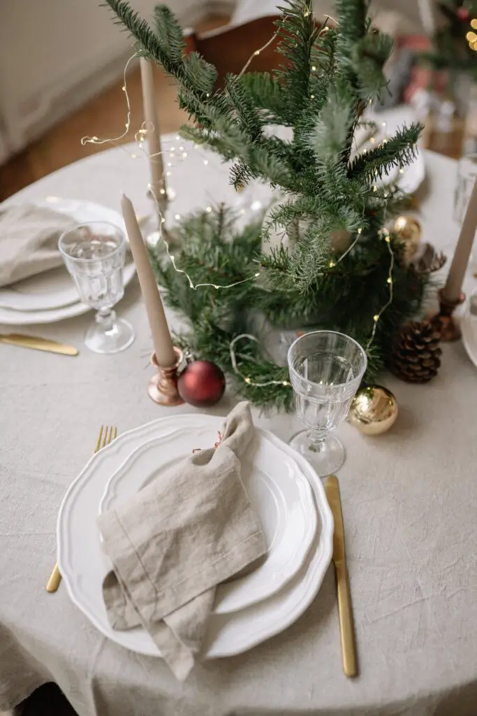 Elegant Minimalist Setting: Pine Centerpiece with Fairy Lights — Christmas Wedding Decor