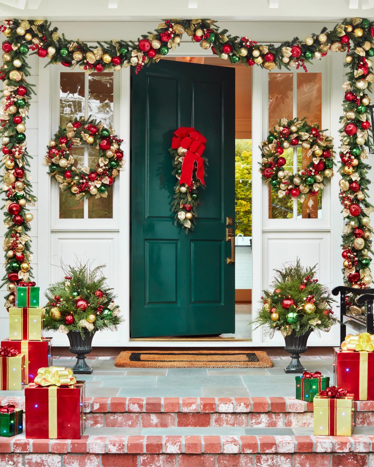 Abundant Christmas Decorations on a Dark Green Doorway — Small Christmas Porch
