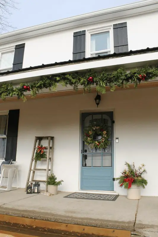 Festive Farmhouse Front Door with Wreath and Ladder Festive Farmhouse Front Door with Wreath and Ladder — Farmhouse Christmas Porch