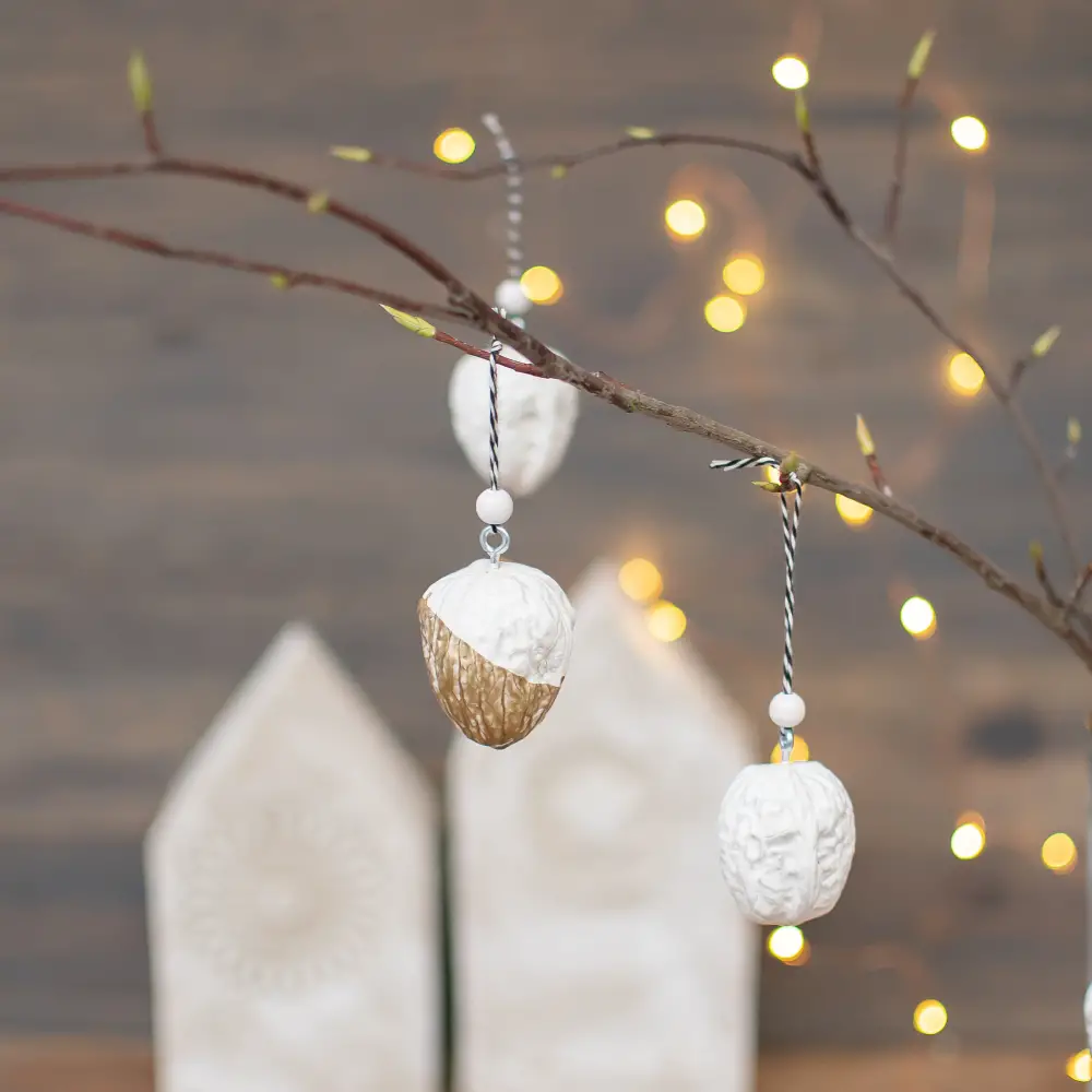 Gold-Dipped Nut Ornaments on a Bare Branch — DIY Christmas Ornaments