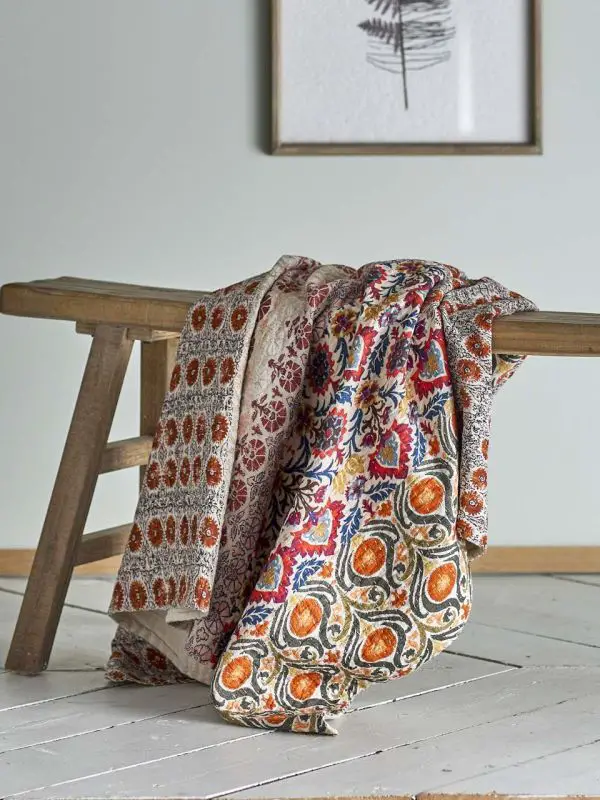 Boho Living Room with Vibrantly Patterned Quilted Throw Boho Living Room with Vibrantly Patterned Quilted Throw — Hygge Home Decor