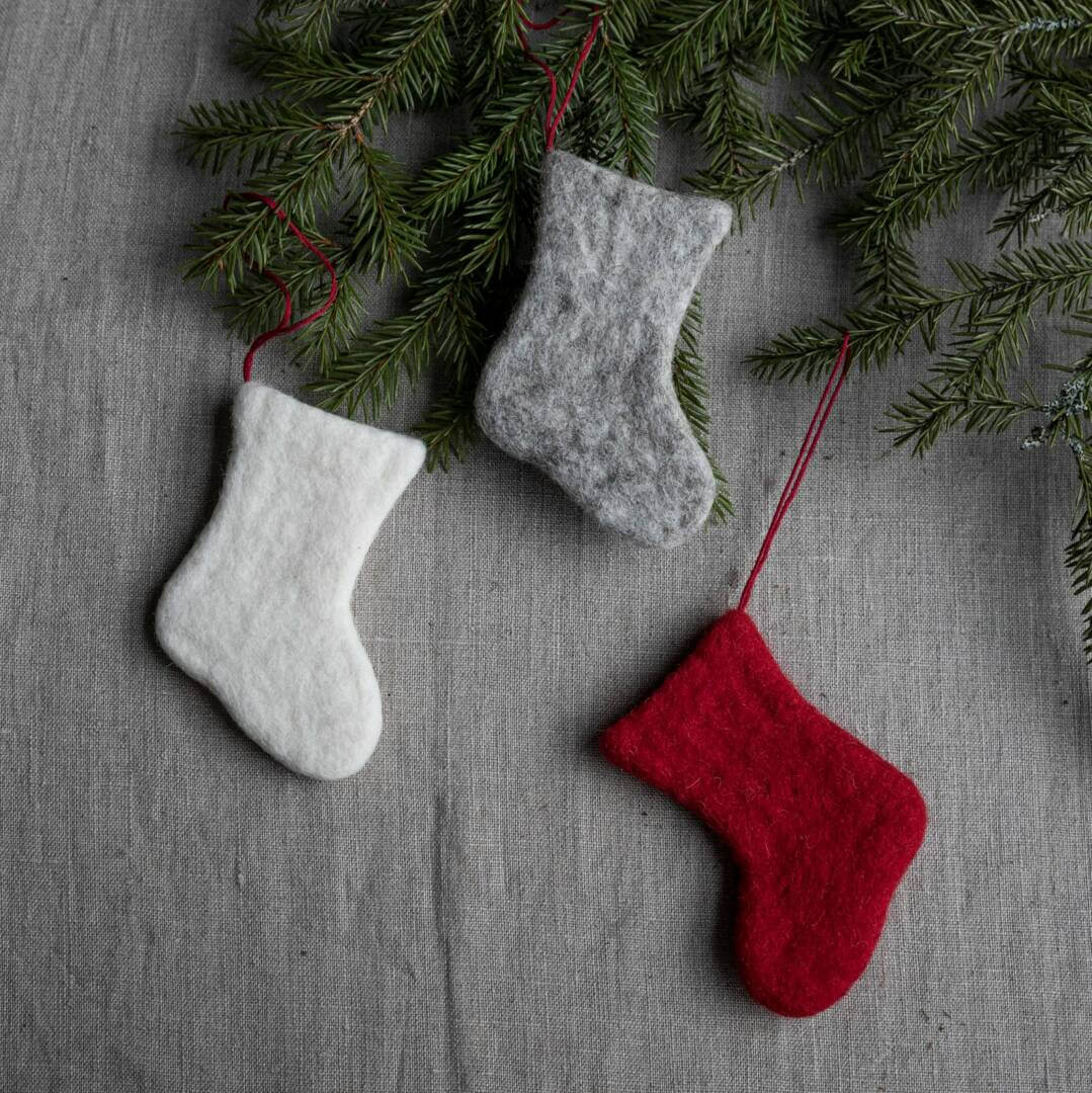 Scandi Felt Stockings on Pine Branches — Christmas Stockings Display