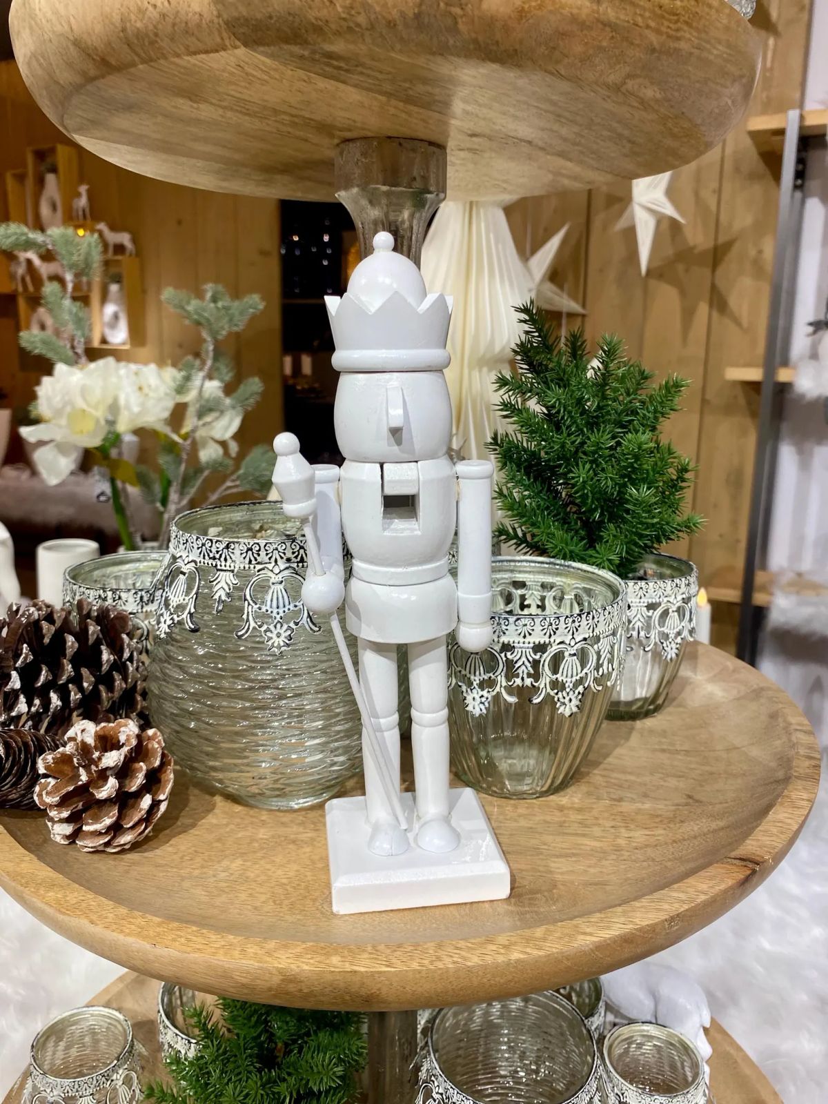 Elegant All-White Nutcracker on a Tiered Display Stand — Nutcracker Display