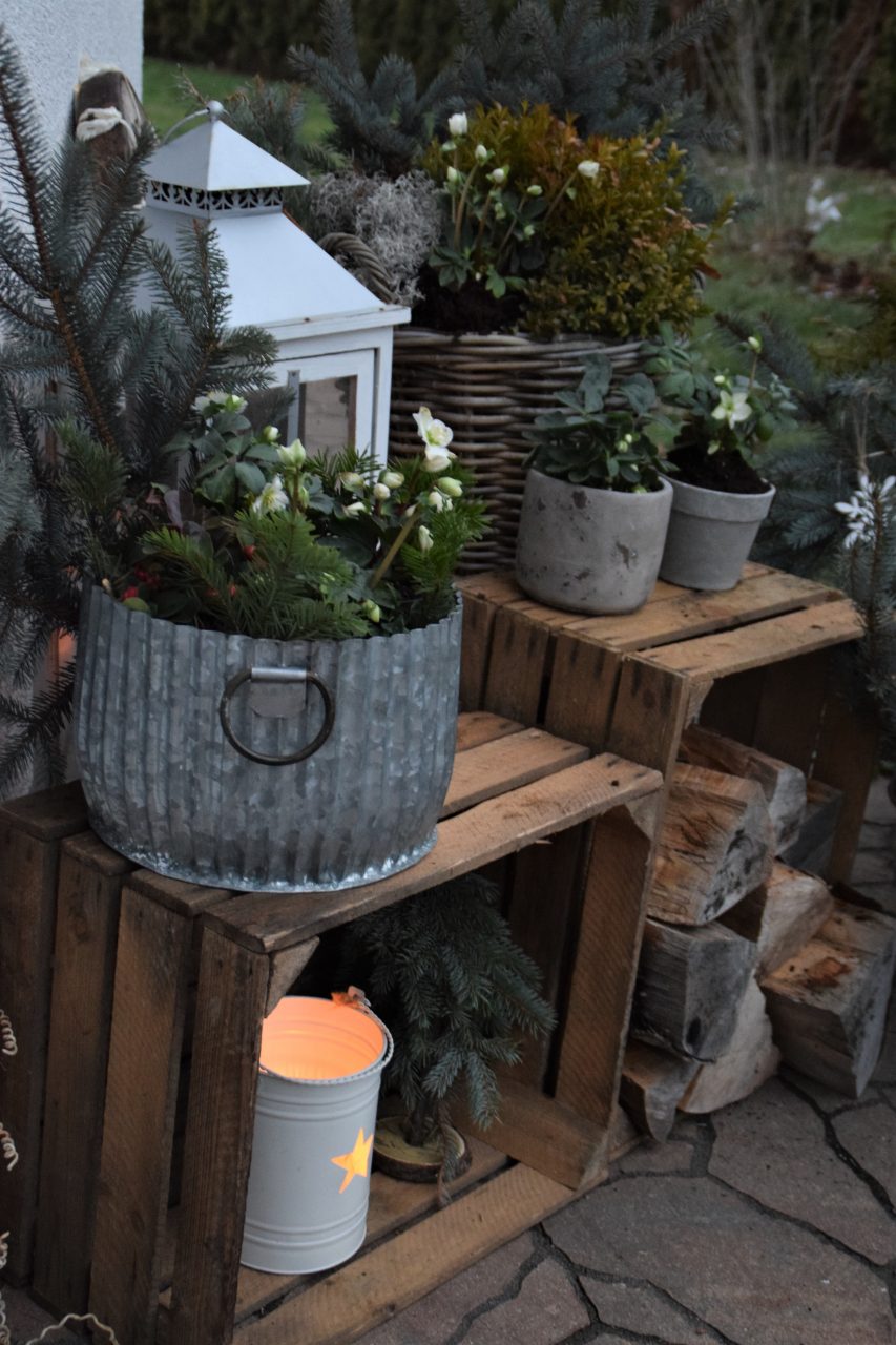 Rustic Porch Vignette with Stacked Crates and Galvanized Planters — Winter Porch Decor