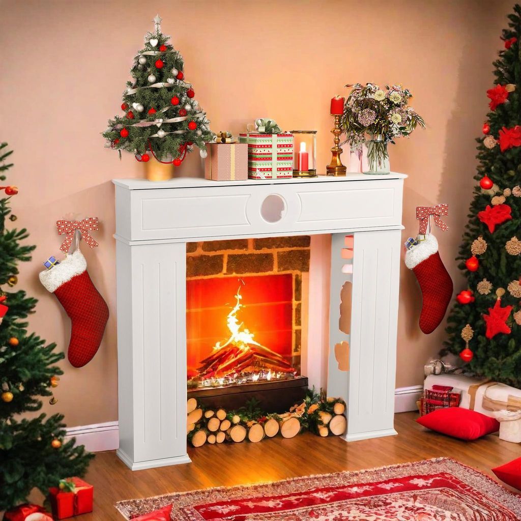 White Freestanding Fireplace with Stockings and Mini Christmas Tree — Christmas Fireplace Decor