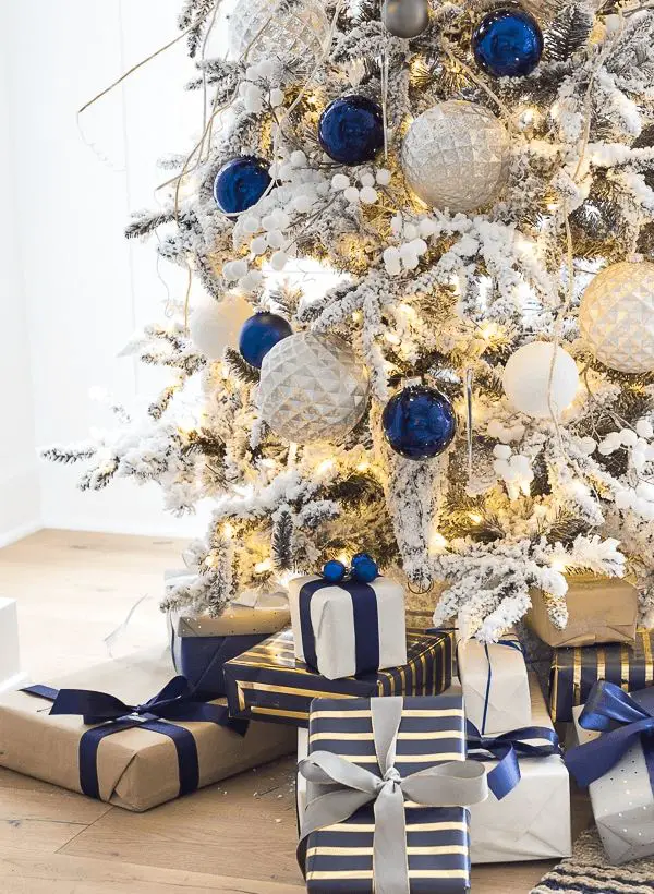 Flocked Christmas Tree with Blue and Silver Ornaments — Christmas Tree Trends 2026