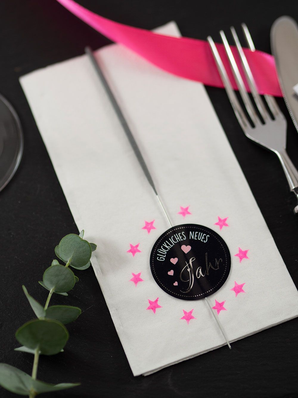 Sparkler and 'Glückliches Neues Jahr' Sticker Detail Sparkler and 'Glückliches Neues Jahr' Sticker Detail — New Years Eve Party Decor