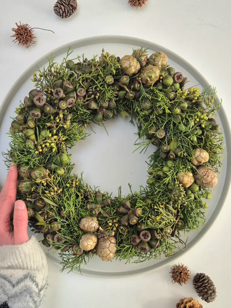 Natural Cedar and Eucalyptus Wreath on a Grey Plate Natural Cedar and Eucalyptus Wreath on a Grey Plate — Ornament Wreath
