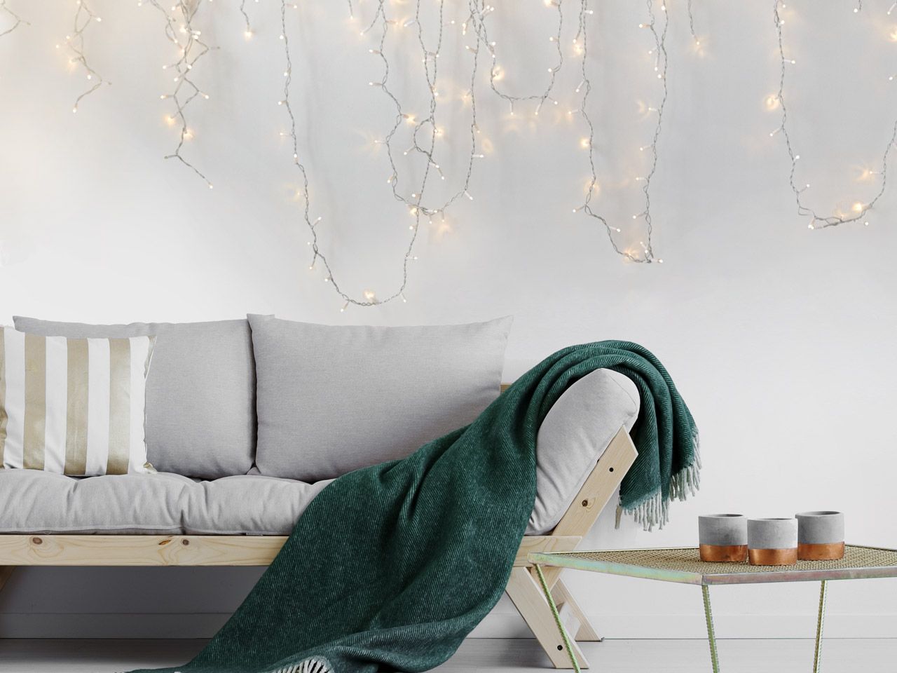 Minimalist Scandi Living Room with Cascading Fairy Lights Over Sofa Minimalist Scandi Living Room with Cascading Fairy Lights Over Sofa — Christmas Fairy Lights Living Room