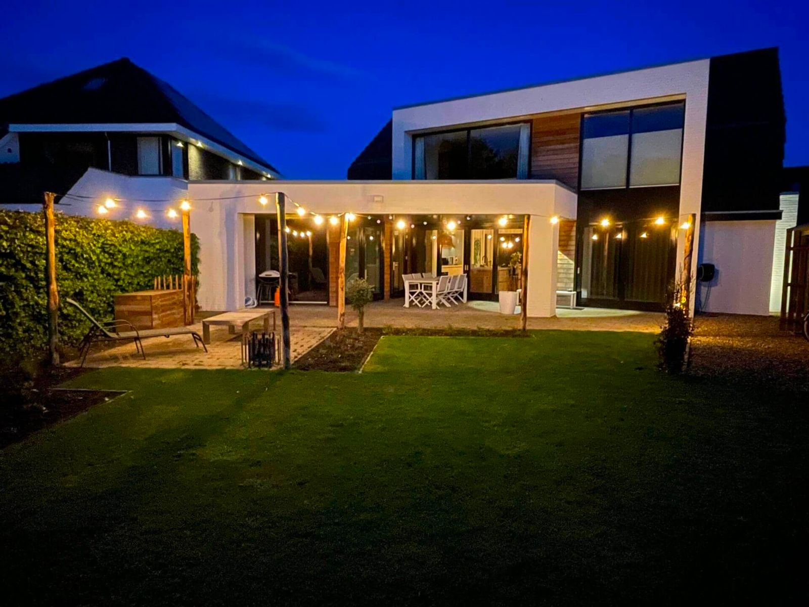 Modern Patio Illuminated by Overhead String Lights — Outdoor Christmas Lights