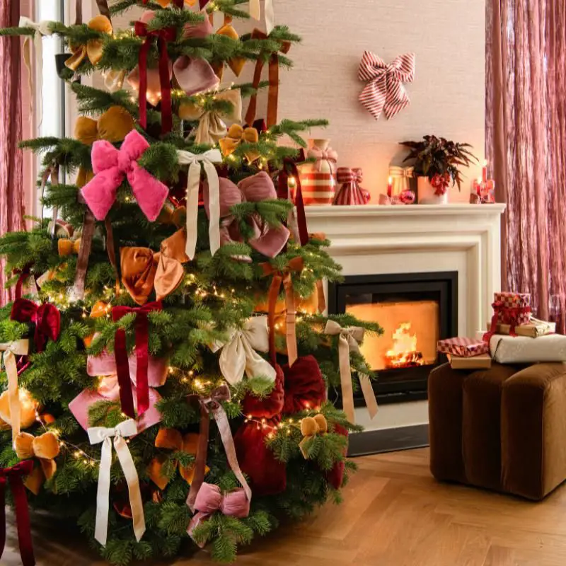 Festive Living Room with Velvet Bow Christmas Tree and Fireplace — Christmas Fireplace Decor