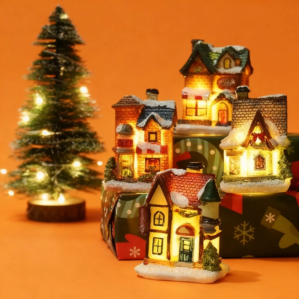 Illuminated Houses on Gift-Wrapped Boxes — Christmas Village Display