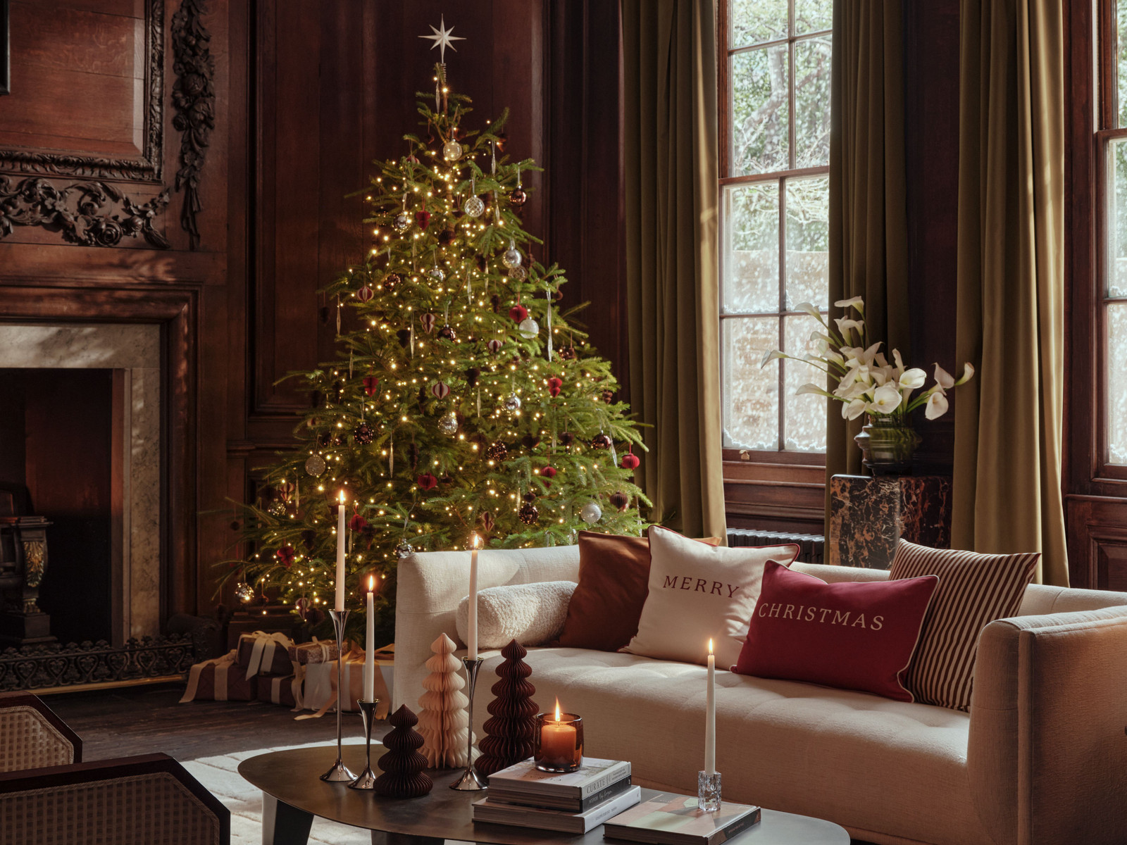 Traditional Christmas Tree by a Fireplace in a Cozy Living Room Setting — Glam Christmas Tree