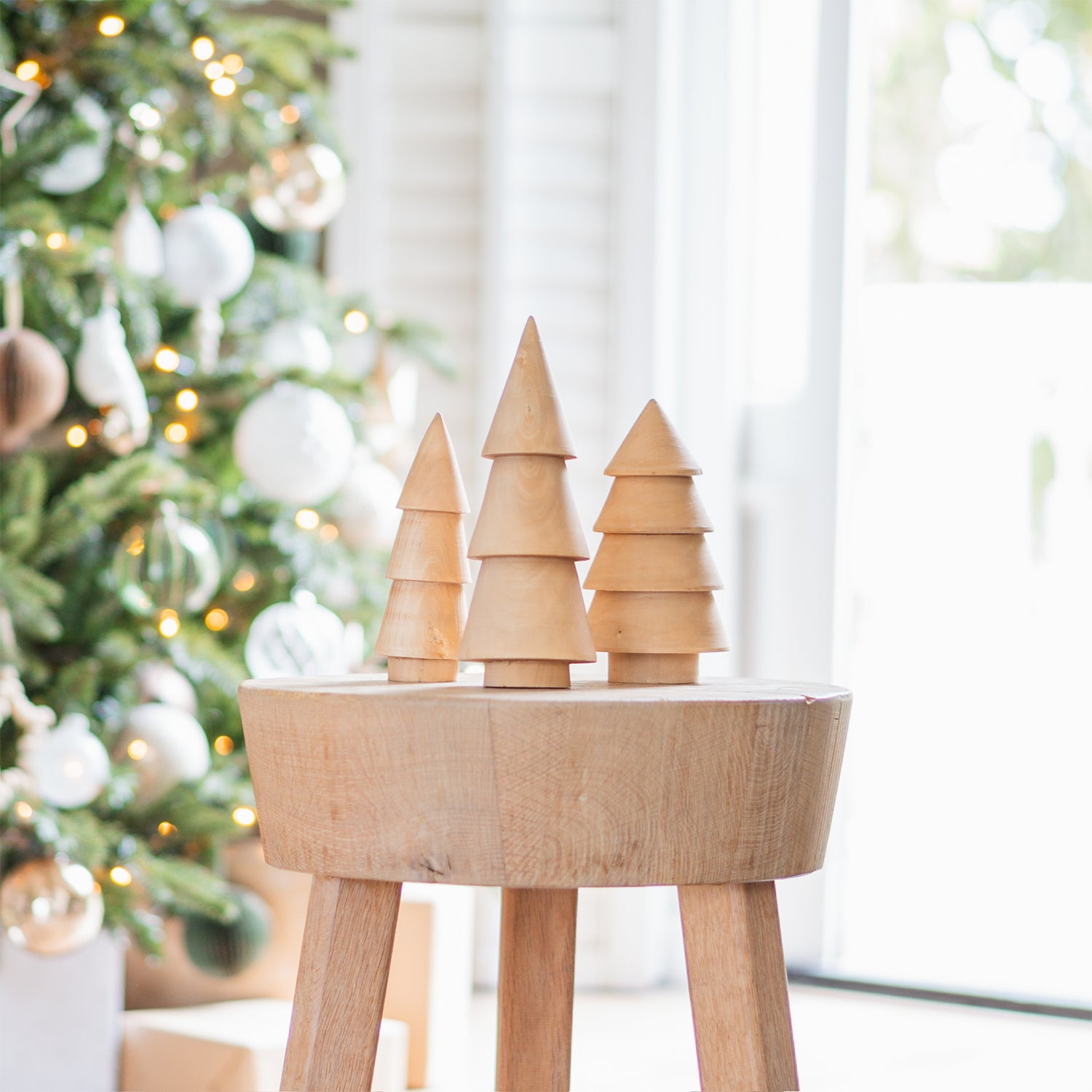 Wooden Trees Vignette on a Round Stool — Minimalist Christmas Tree