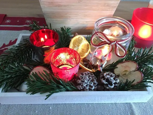 Rustic Christmas Centerpiece with Red Votive Holders on Tray Rustic Christmas Centerpiece with Red Votive Holders on Tray