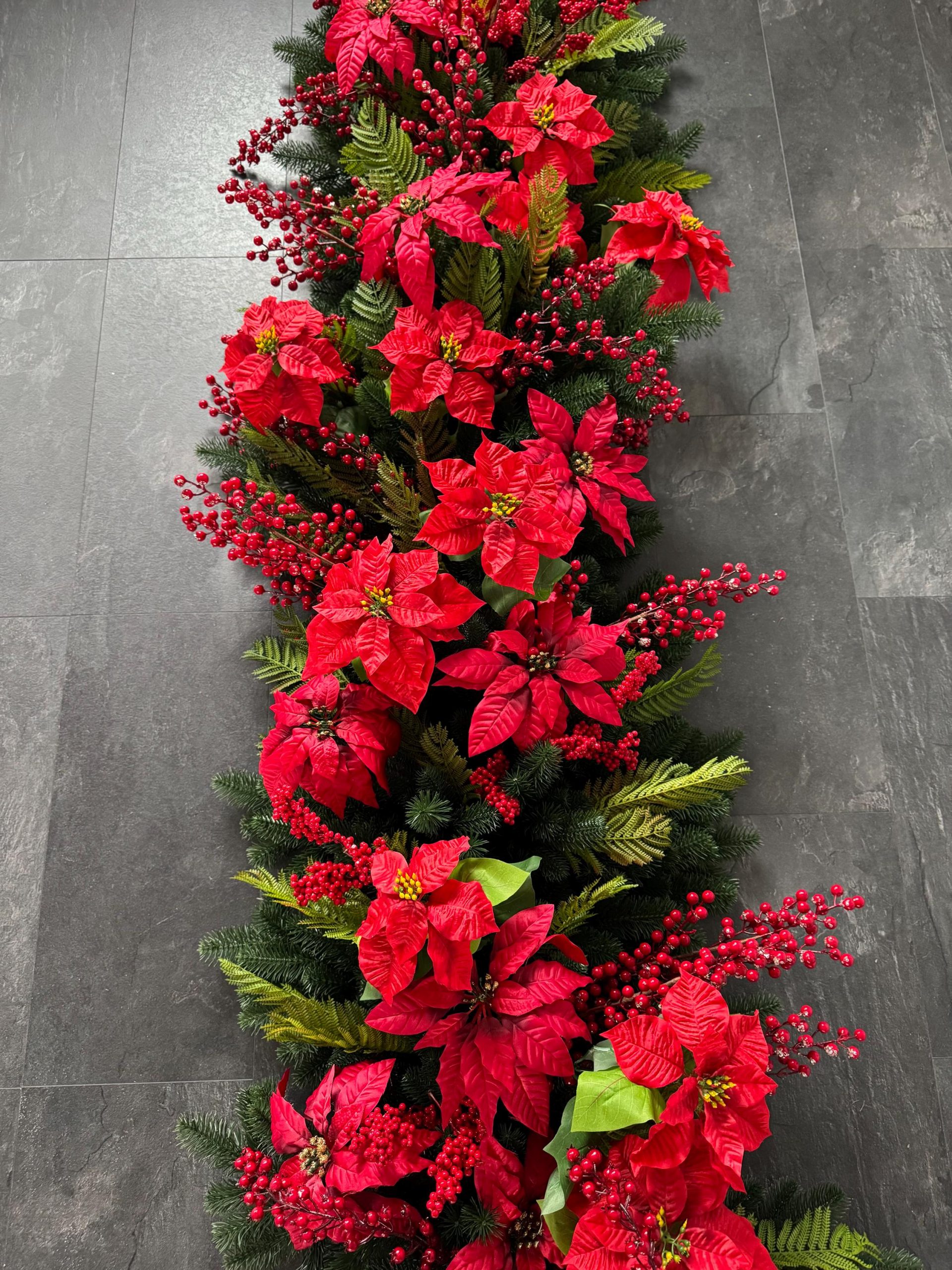 Luxurious Garland Packed with Red Poinsettias and Berries — Christmas Garland