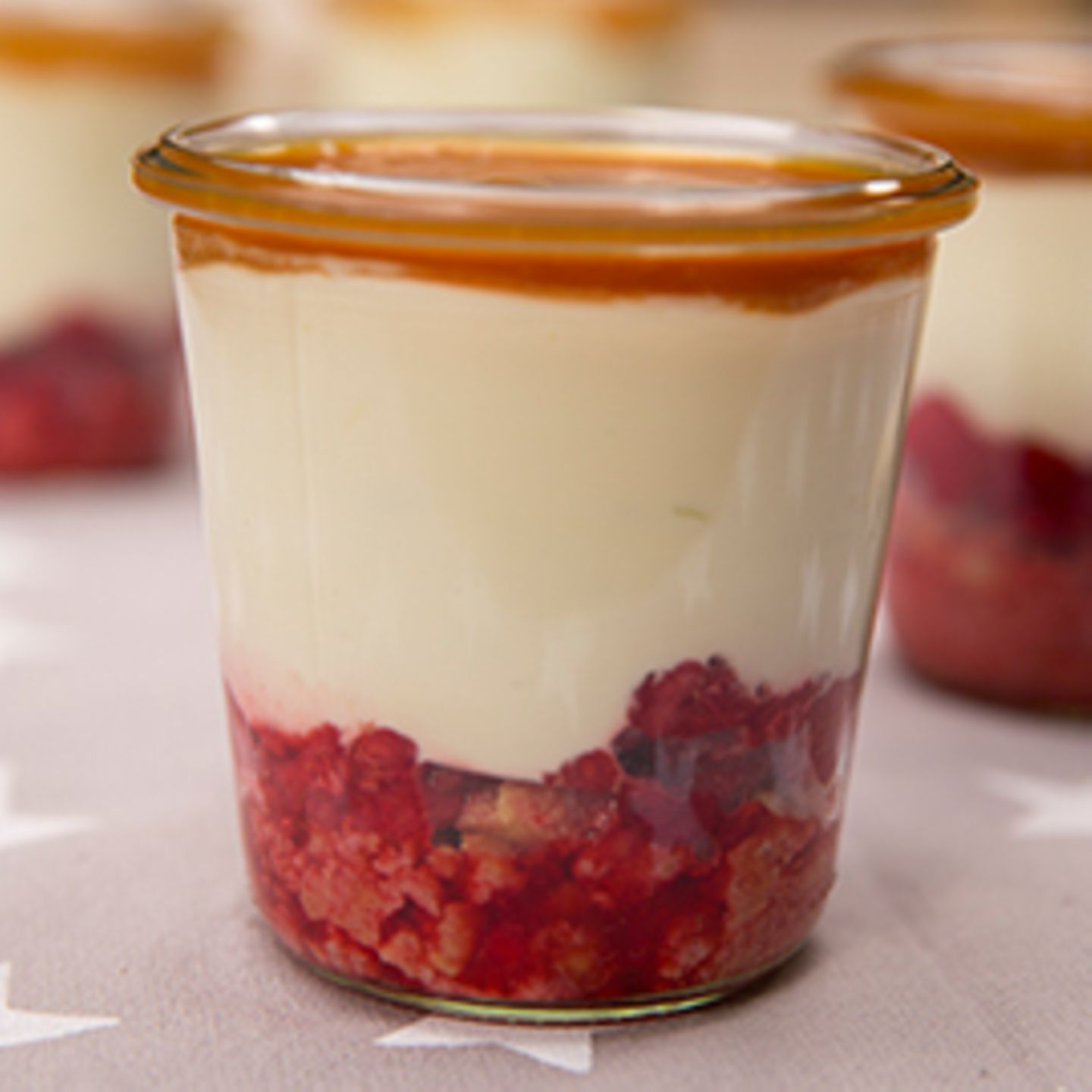 Minimalist Desserts in Glasses Highlighting Red Fruit Layers — New Years Eve Dessert Table