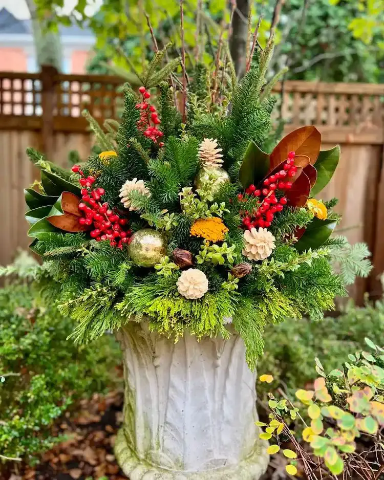 Ornate Stone Planter Overflowing with Festive Greenery Ornate Stone Planter Overflowing with Festive Greenery — Christmas Porch Planters