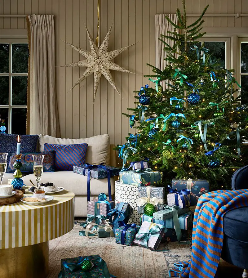 Cozy Living Room with Blue and Green Christmas Tree and Star Lantern — Whimsical Christmas Decor