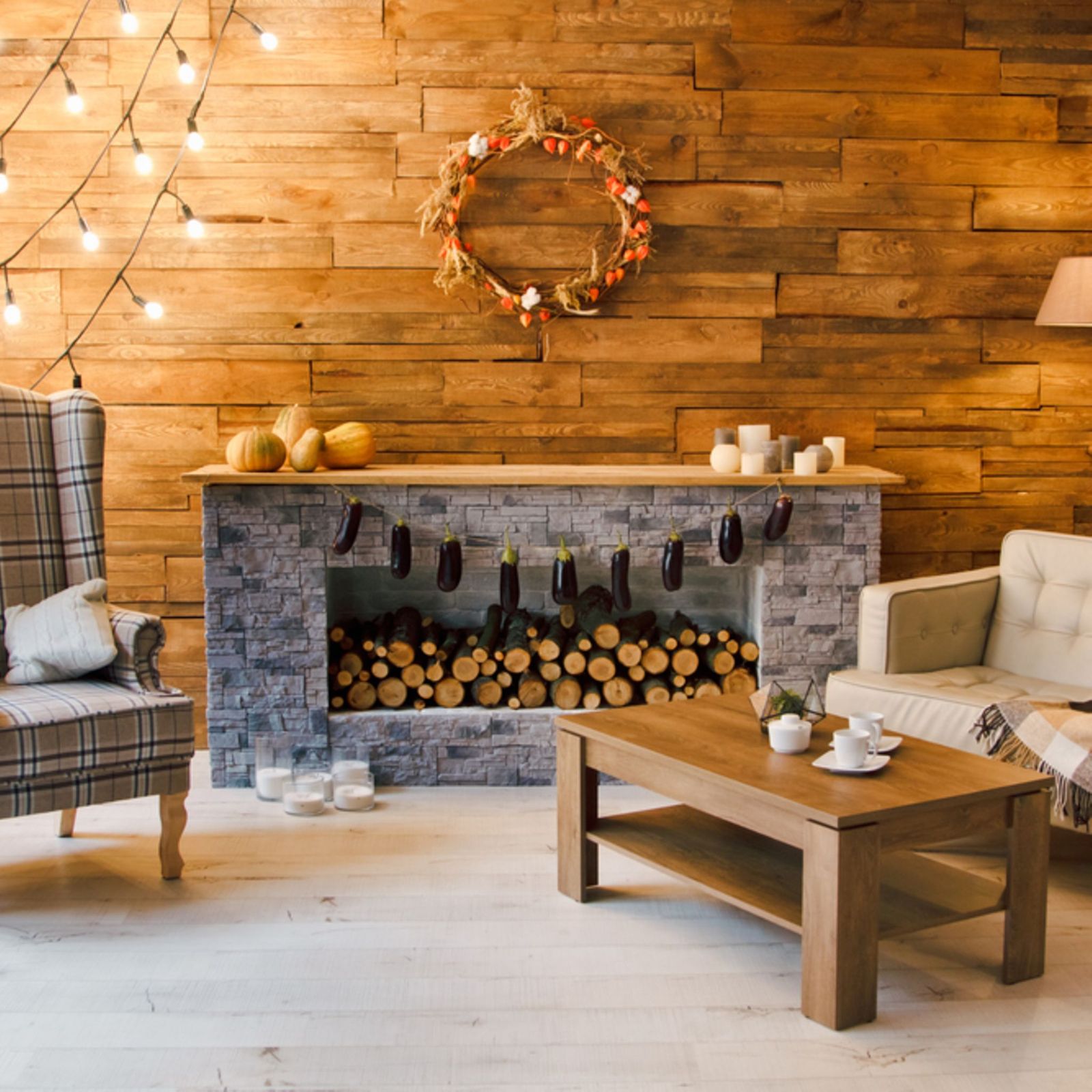 Rustic Stone Fireplace with Fall-Themed Wreath and Wood Paneling — Christmas Fireplace Decor