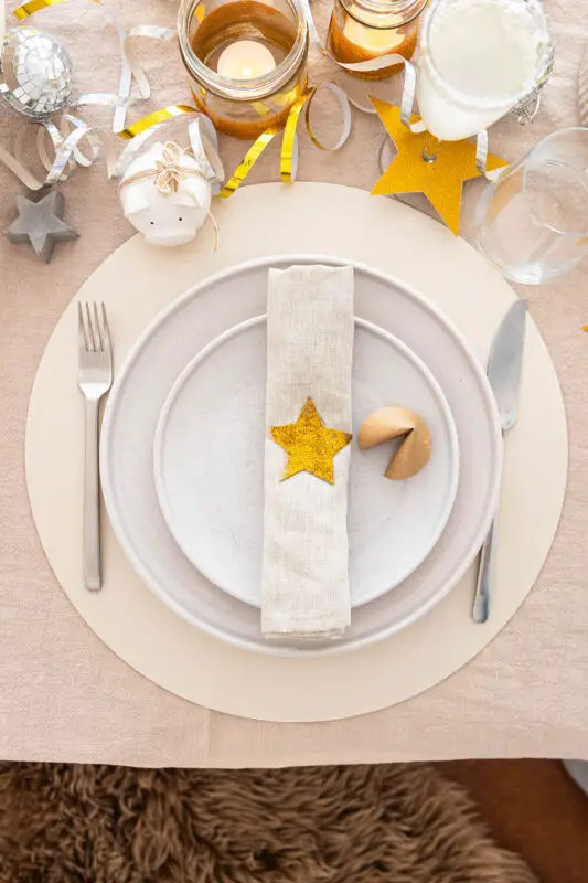 Minimalist Beige and Grey Place Setting with Gold Star Detail Minimalist Beige and Grey Place Setting with Gold Star Detail — New Years Eve Table Decor