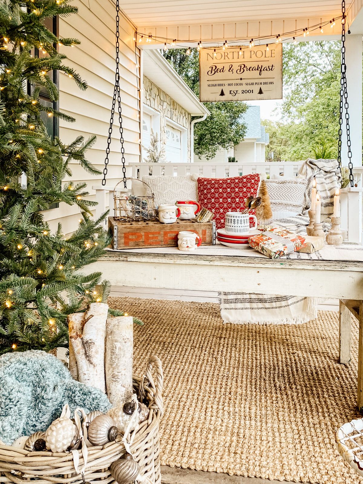 Cozy Farmhouse Porch Swing with Festive Mugs Cozy Farmhouse Porch Swing with Festive Mugs — Farmhouse Christmas Porch