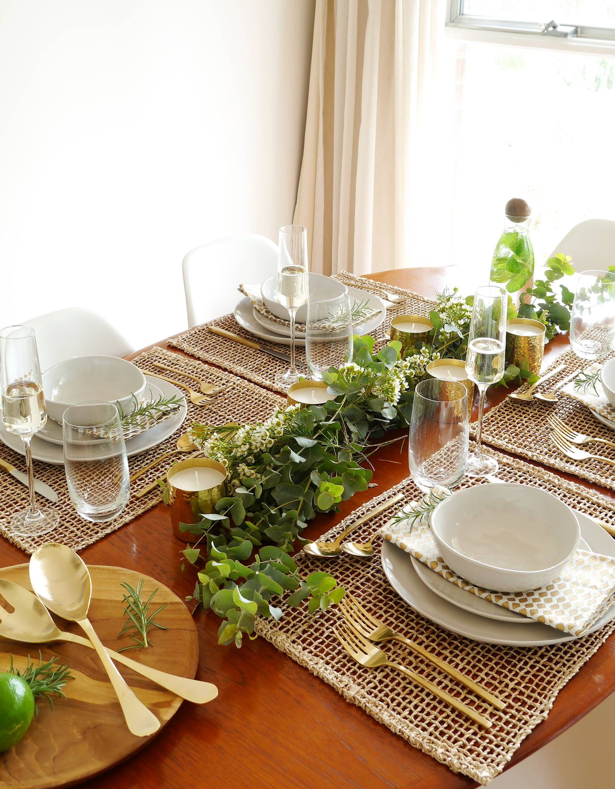 Modern Natural Dining Table with Greenery Runner and Gold Accents — Christmas Dining Room Decor