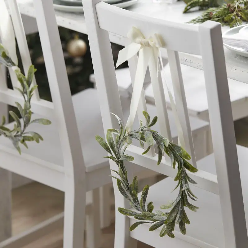 Rustic Chair Decor: Frosted Greenery Wreaths — Christmas Wedding Decor