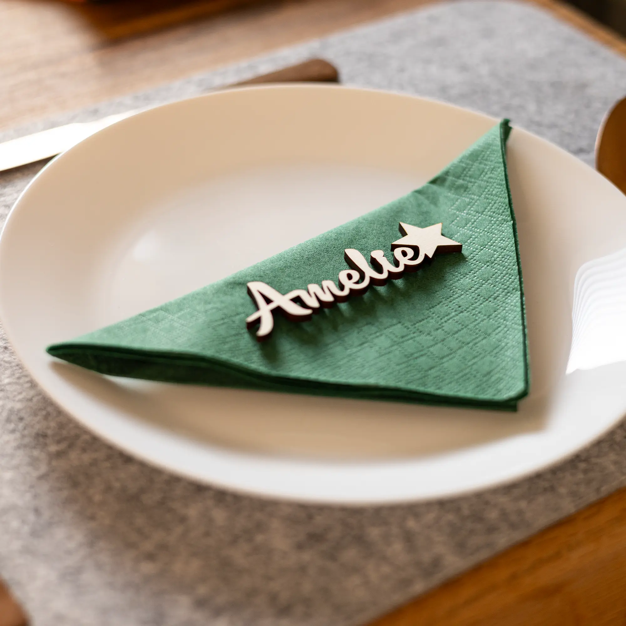 Natural Wood Snowflake Place Card on Green Napkin — Christmas Place Cards