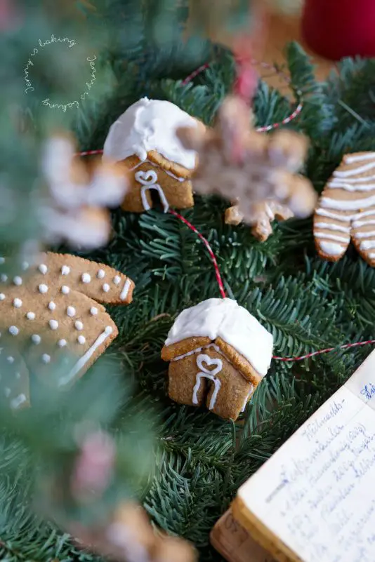 Miniature Gingerbread Ornaments on Fresh Pine Branches Miniature Gingerbread Ornaments on Fresh Pine Branches — Gingerbread Christmas Decor